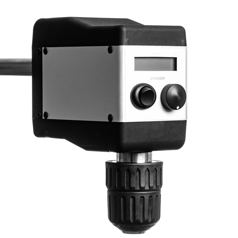 Close-up view of a SpinChem 60W stirrer motor featuring a black and white housing with digital display screen and two control knobs on the front panel. The motor unit includes a black chuck mechanism for secure shaft mounting, shown against a white background in monochrome.