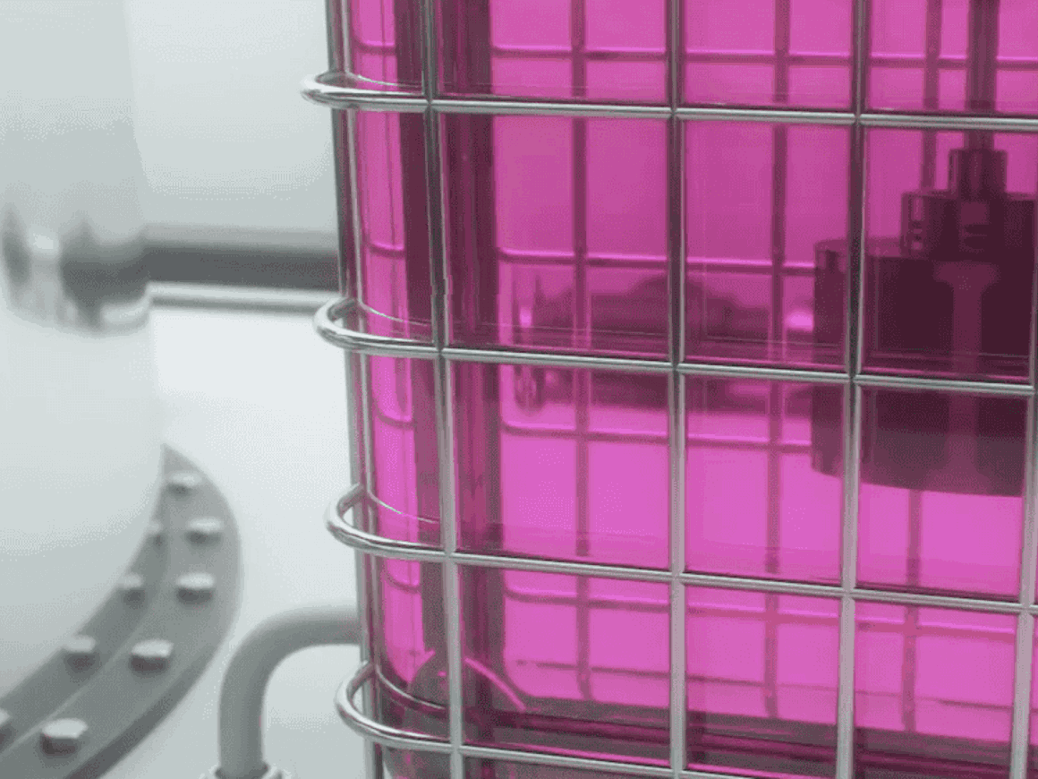 Close-up of SpinChem process reactor with circulating pink liquid, demonstrating intensified mixing and solid-liquid processing technology.